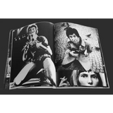 Open book with black and white photographs.