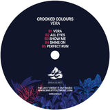 Dark blue vinyl record label for crooked colours vera lp splash vinyl in picture sleeve with white text and sneaker illustration