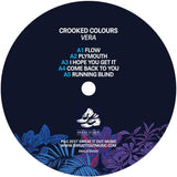 Dark blue vinyl record label of crooked colours vera splash vinyl in picture sleeve featuring tropical shoe illustration