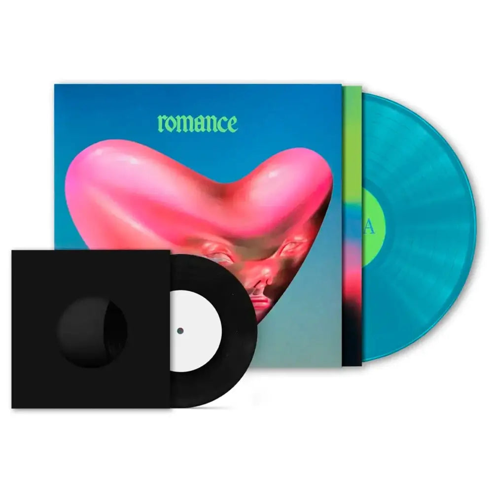 A record album with a pink heart-shaped face on the cover, accompanied by two vinyl records.