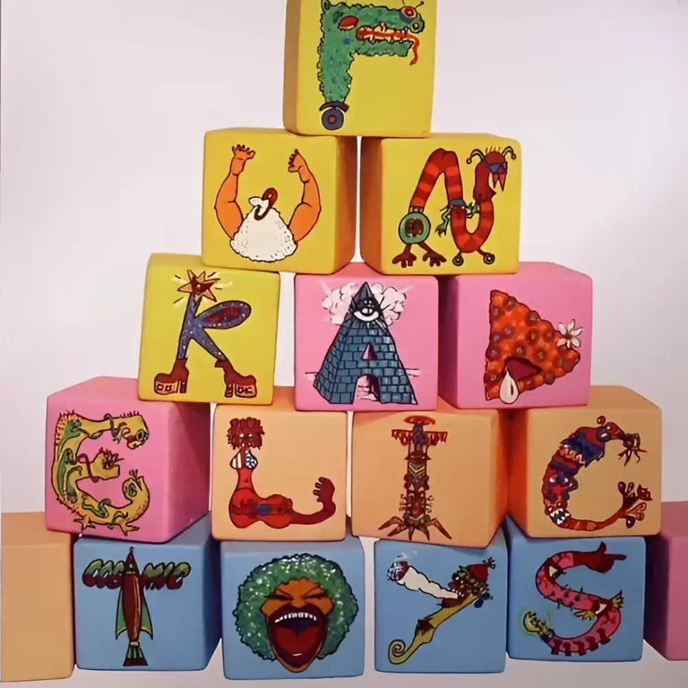 Stack of alphabet blocks with cartoon illustrations.