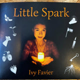 Book cover with a woman holding a candle.