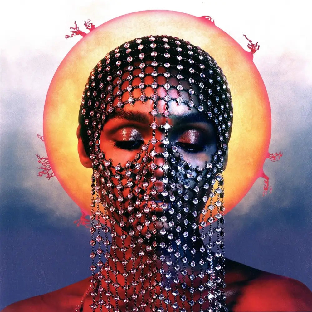 Person wearing jeweled head covering.