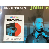 Limited edition orange 180-gram colored vinyl record of ’blue train’ by john coltrane.