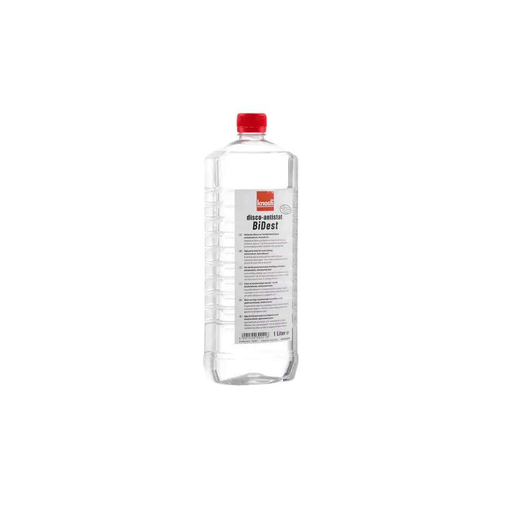 A clear plastic bottle with a red cap, containing a transparent liquid.