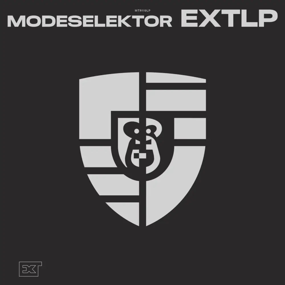 Album cover for Modeselektor’s ’EXTLP’ featuring a stylized shield with a monkey head.