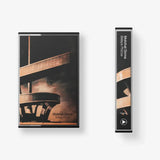 Cassette tape with architectural cover art.